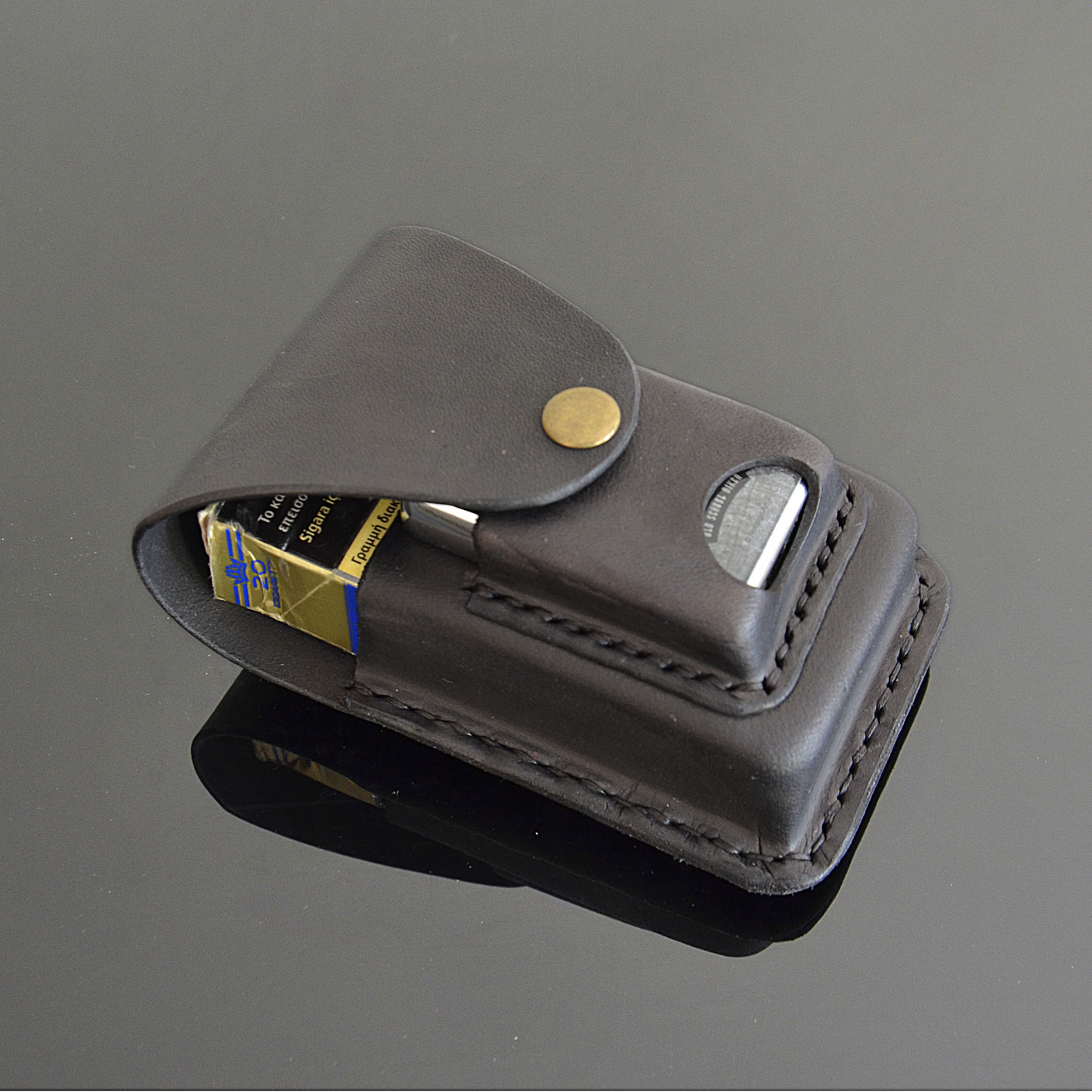 Handcrafted black premium leather cigarette case, showing compartments for King Size 100s or slim cigarettes and lighter holder.