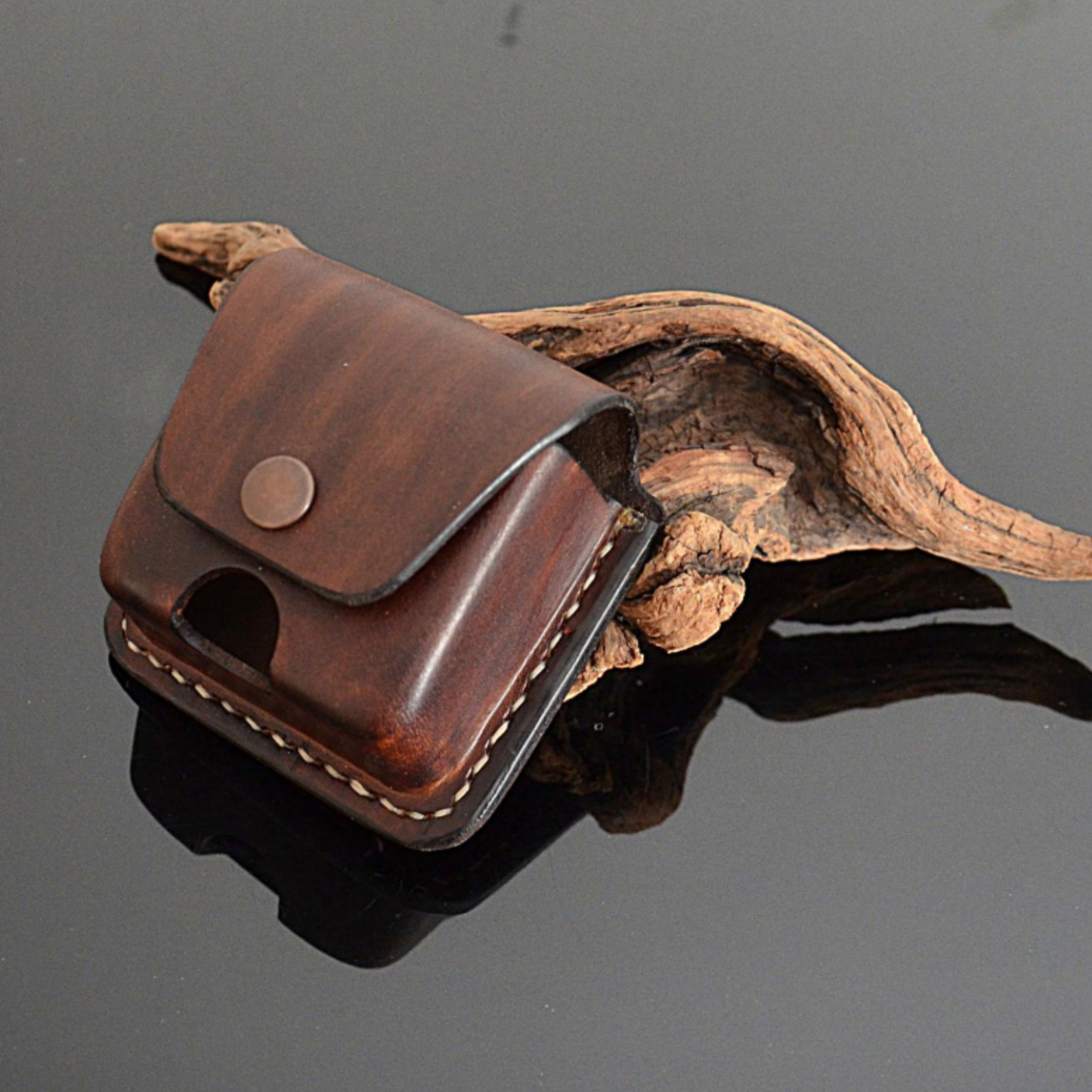 Side angle of brown leather Powerbeats Pro 2 pouch with belt clip and secure snap closure
