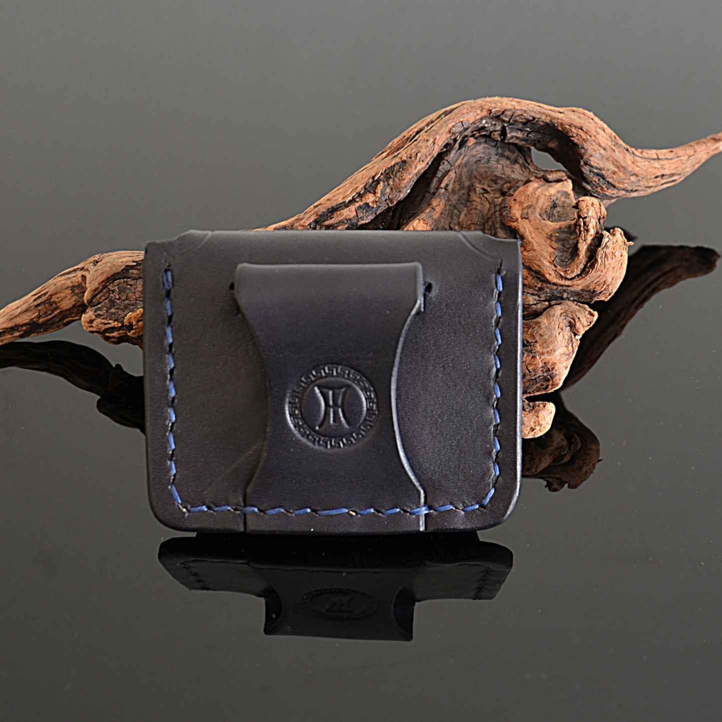Back side of exodos copenhagen leather earbuds case showing belt loop precise stitching