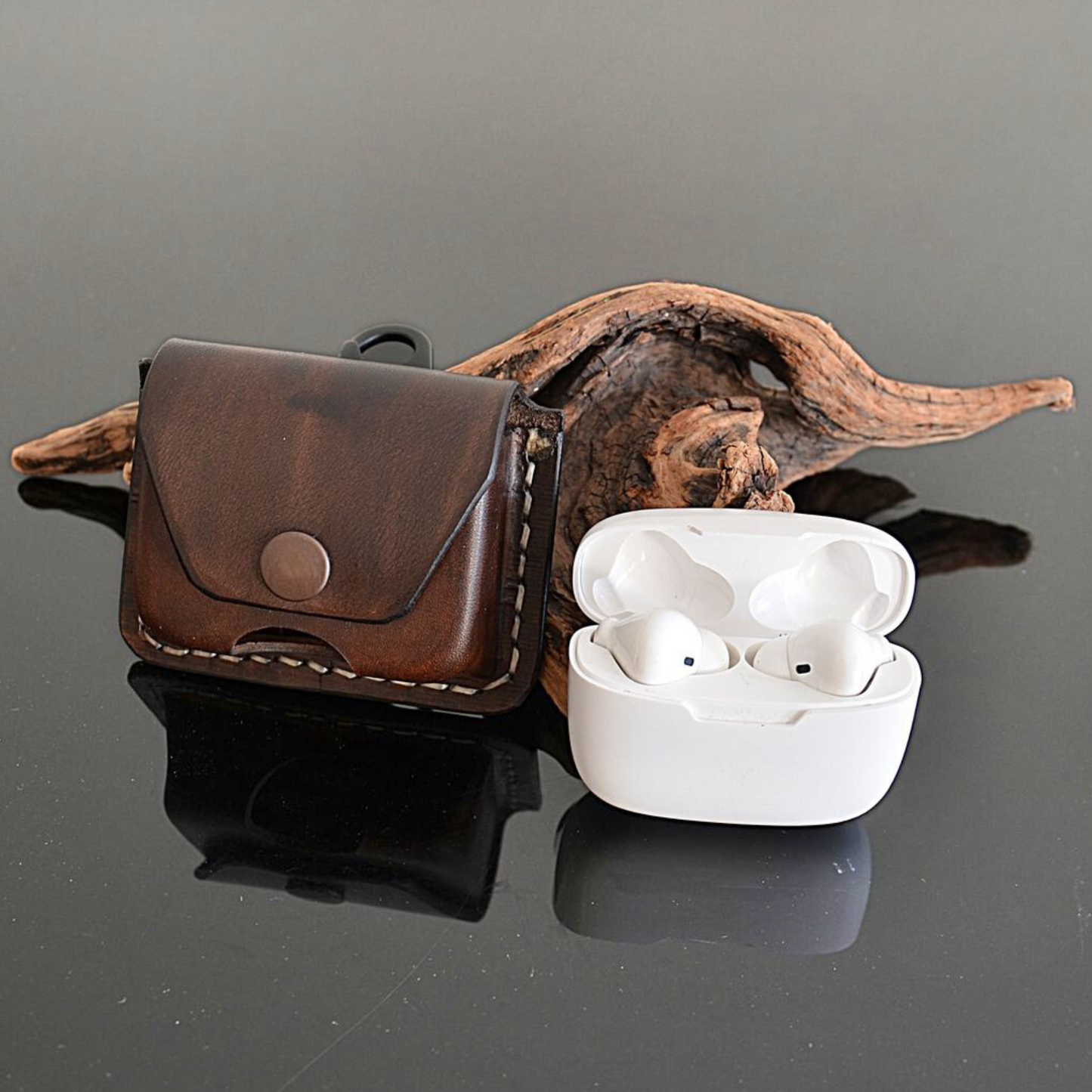 Front of brown leather pouch for AirPods Sony and Galaxy earbuds with belt clip and secure snap closure