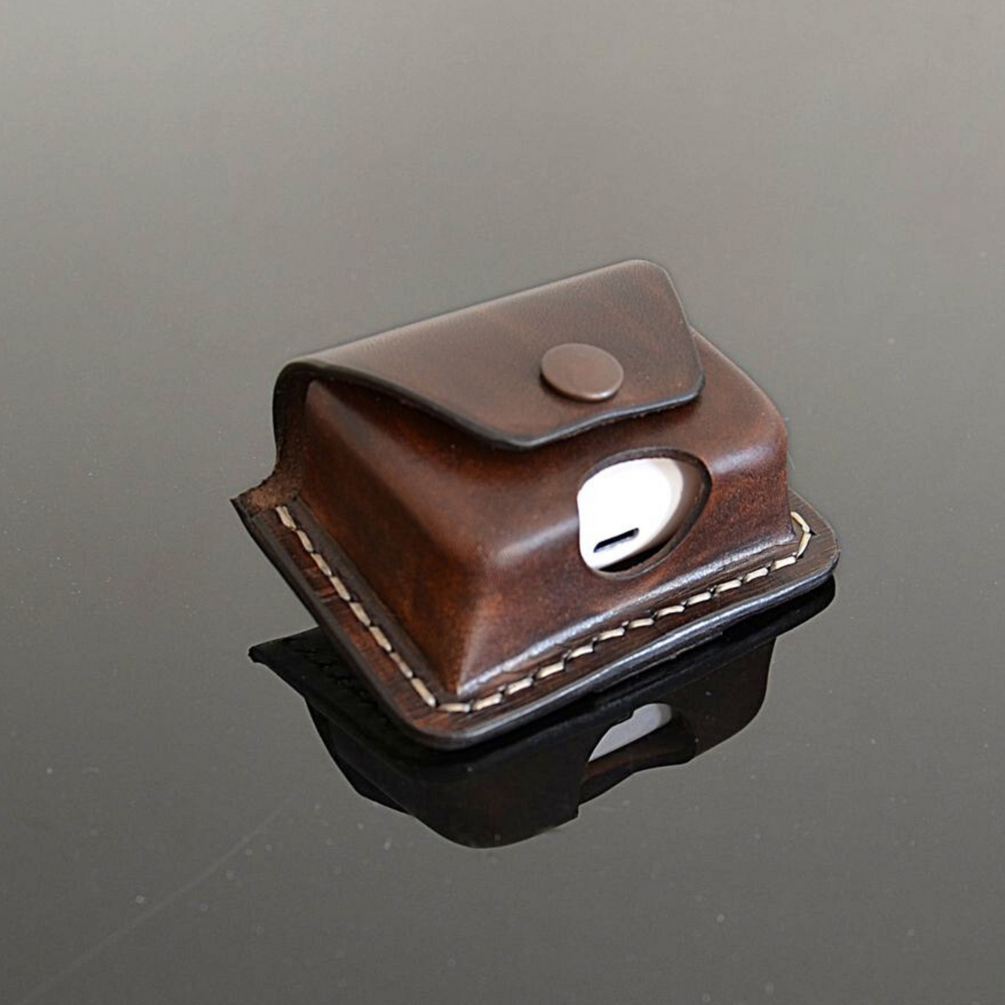 Handcrafted leather earbuds belt pouch in brown by EXODOS Copenhagen
