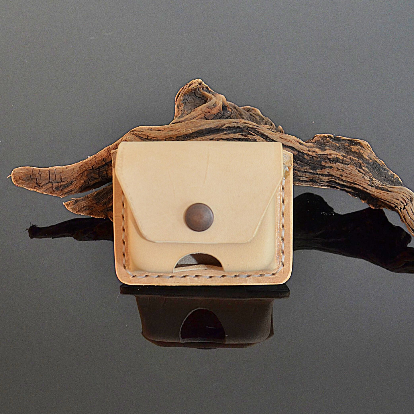 Handcrafted earbuds belt pouch in natural undyed premium leather by EXODOS Copenhagen