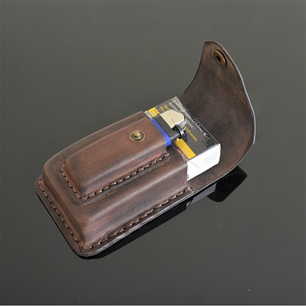 Brown leather cigarette case with integrated BIC lighter pocket